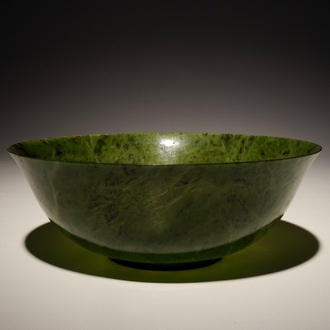 A Chinese thin-walled spinach green jade bowl, 20th C.